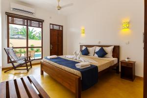 Ένα ή περισσότερα κρεβάτια σε δωμάτιο στο Bentota Luxe