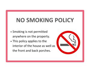 Un letrero indica que no se permite fumar en ninguna parte de la propiedad. en Stylish 3BR 3BA Colonial House by CozySuites, en Alexandria