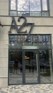 a large sign on the front of a building at A27 Apartments in Almaty