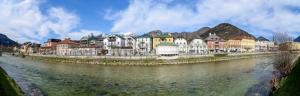 a group of buildings next to a river at Traunkai Apartments - Zimnitz Blick in Bad Ischl