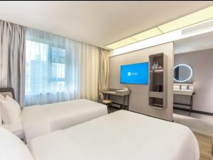 Μια τηλεόραση ή/και κέντρο ψυχαγωγίας στο Hanting Hotel Shanghai Fudan University Memorial Road