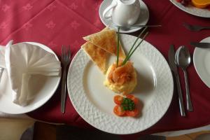 a plate with a piece of food on a table at Rockmount House B&B in Clifden