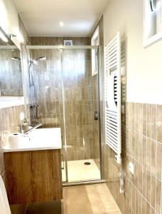 a bathroom with a sink and a shower at Houseboat Sneek in Sneek