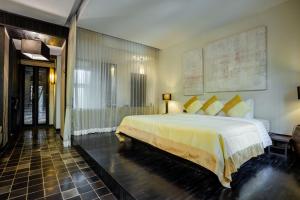 Postel nebo postele na pokoji v ubytování Aruntara Riverside Boutique Hotel + 68 fotografií