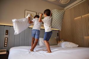 Postel nebo postele na pokoji v ubytování Grand Hotel Central, Small Luxury Hotels