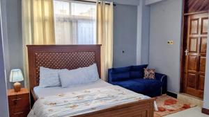 Postel nebo postele na pokoji v ubytování Arusha StayScape