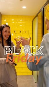 a woman is holding a glass of wine at Nest Style Valencia in Valencia