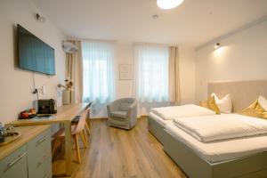 Μια τηλεόραση ή/και κέντρο ψυχαγωγίας στο Apartments Salzburg - Bergstraße