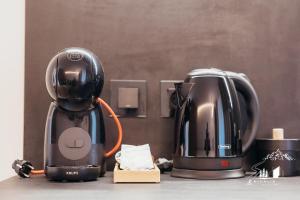 Příslušenství pro přípravu čaje a kávy v ubytování Nivalis Resort and Spa