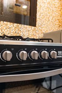 a black stove top oven in a kitchen at Casa Hôtel Résidence in Abidjan