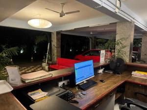 an office with a desk with a computer on it at La Millionaire Luxury Resort - TIE Hotels & Resorts in Puducherry