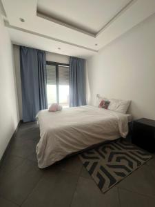 Ένα ή περισσότερα κρεβάτια σε δωμάτιο στο Appart hôtel welcome +23 φωτογραφίες