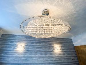 a large chandelier hanging from a ceiling at Berwick Lodge in Thornton