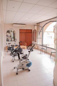 a gym with several exercise bikes in a room at City Hotel Termal in Termas de Río Hondo