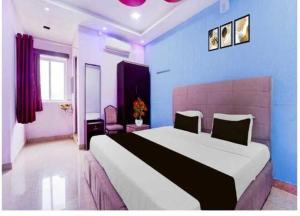 Ένα ή περισσότερα κρεβάτια σε δωμάτιο στο Collection O Mappedu Chennai Formerly Nitas Business Hotel