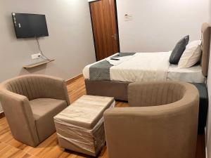 Μια τηλεόραση ή/και κέντρο ψυχαγωγίας στο Townhouse Financial District Circle Hyderabad +13 φωτογραφίες