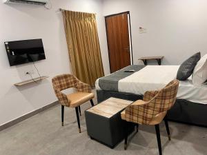 Μια τηλεόραση ή/και κέντρο ψυχαγωγίας στο Townhouse Financial District Circle Hyderabad