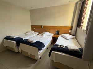 Postel nebo postele na pokoji v ubytování Hotel New Brás