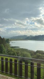 a view of a body of water from a balcony at L'Échappée Belle du Lac in Malbuisson