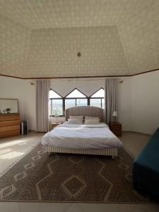 Ένα ή περισσότερα κρεβάτια σε δωμάτιο στο Peace Farm