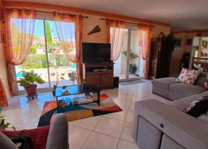 Posezení v ubytování Lauriers roses - Chambre D'hôtes