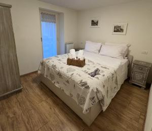 a bedroom with a bed with two candles on it at Sant'Orso Cozy Home in Cogne