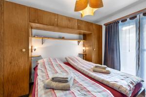 Ένα ή περισσότερα κρεβάτια σε δωμάτιο στο Anemones 15 - 7 pers - centre & piscine