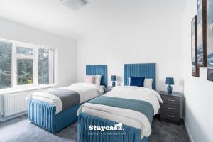 Postel nebo postele na pokoji v ubytování Spacious 4-bed Home Near Didsbury