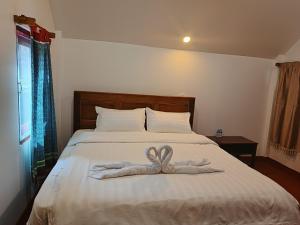 Postel nebo postele na pokoji v ubytování Namnoncave Resort