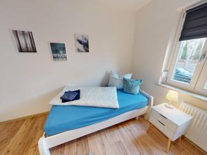 Ένα ή περισσότερα κρεβάτια σε δωμάτιο στο Ferien- und Monteurwohnung "Goitzscheluft"