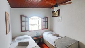 Postel nebo postele na pokoji v ubytování Excelente casa com garagem no centro de Búzios!