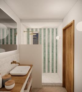 ein Badezimmer mit Waschbecken und Dusche in der Unterkunft Villa d'architecte avec piscine et plage à pied in La Teste-de-Buch