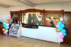 a store with balloons and a counter in a room at Victorian Inn by Belvilla White sboro US Hwy 82 in Whitesboro