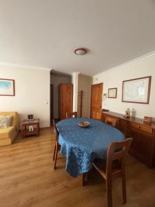 a living room with a table and a couch at Ajuda Mar Holidays in Funchal