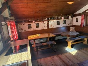 an overhead view of a room with tables and benches at Trail & Tiefschnee Lodge in Reith im Alpbachtal +19 photos