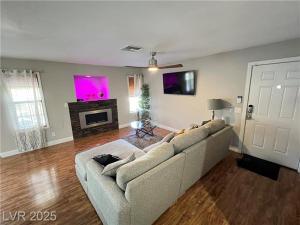 a living room with a couch and a fireplace at T-Designed to ENJOY!. Best Vacation in Las Vegas
