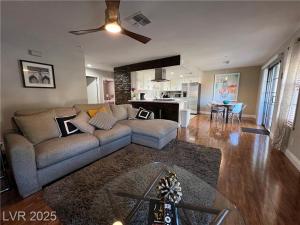a living room with a couch and a kitchen at T-Designed to ENJOY!. Best Vacation in Las Vegas