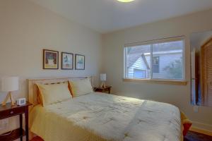 a bedroom with a large bed and a window at Mod Pod in Bend