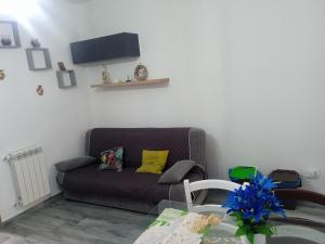 a living room with a couch and a table at Alla cattedrale home in Agrigento