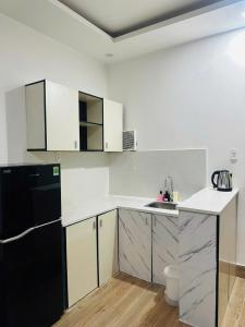 Η κουζίνα ή μικρή κουζίνα στο Full House Hotel Apartment