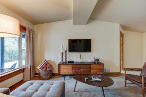 a living room with a couch and a table at The Bend House in Bend