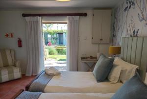 Postel nebo postele na pokoji v ubytování Villa ChoCoLatt Guest House and Porta Taverna Restaurant