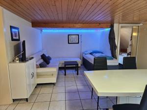 a living room with a couch and a table at Apartment Dorfstrasse 16 in Leuzigen