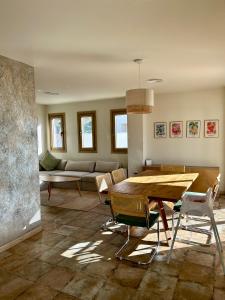 a living room with a table and a couch at Casa Milivan Spacious Family Villa with Private Pool in Las Villas