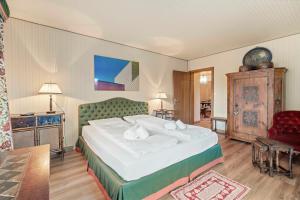 Postel nebo postele na pokoji v ubytování StMoritz Center Vintage Terrace 180 full lake view