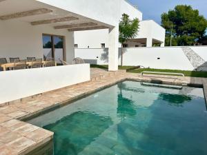 a swimming pool in the backyard of a villa at Casa Milivan Spacious Family Villa with Private Pool in Las Villas