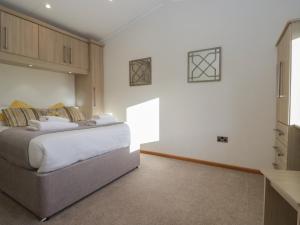 a bedroom with a large bed in a room at Bluebell Lodge in Carnforth