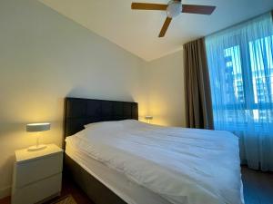 Ένα ή περισσότερα κρεβάτια σε δωμάτιο στο 1BR Urban Hideaway at BW