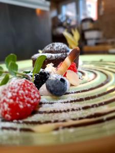 a dessert with fruit and vegetables on a table at Seecamping Berghof - Mobilheime in Landskron