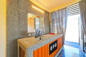 a office with a desk with a computer on it at Super Hotel O York Residency in Bhopal